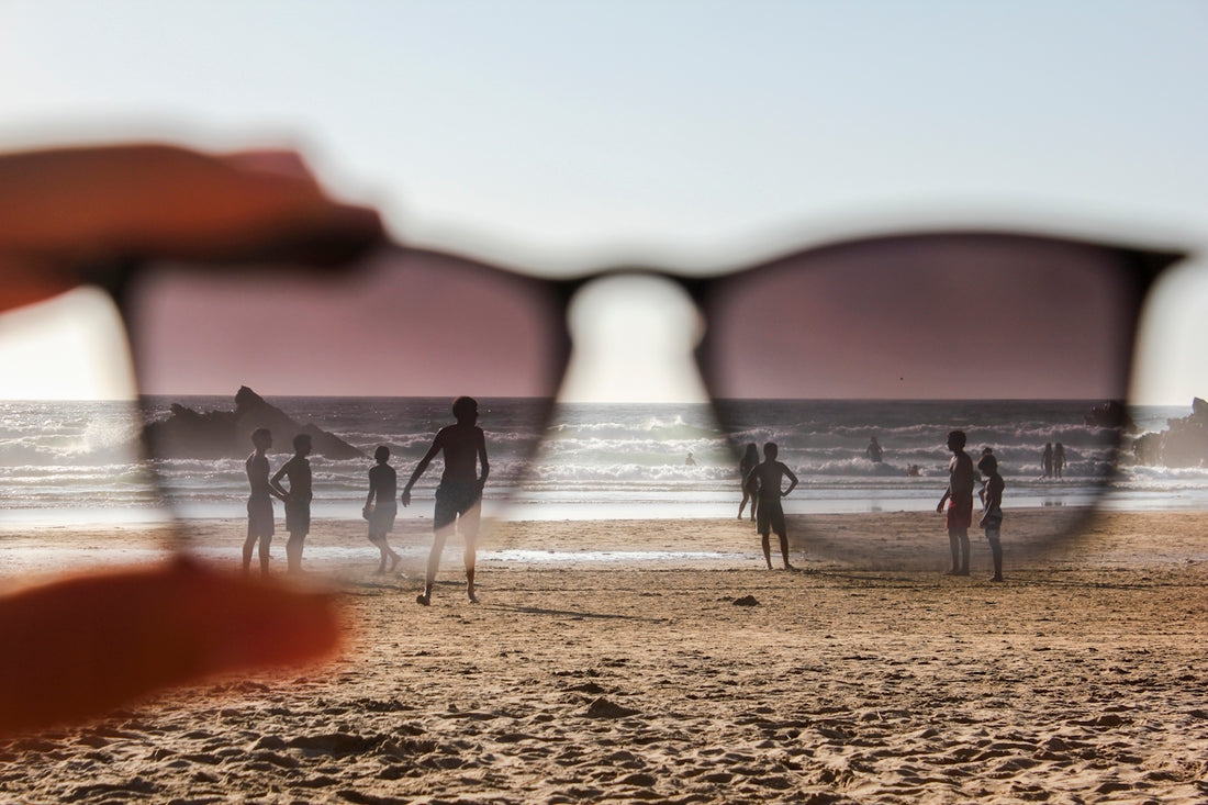 people on beach during sunset