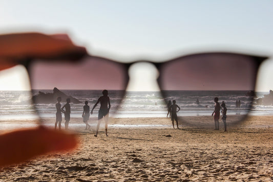 people on beach during sunset